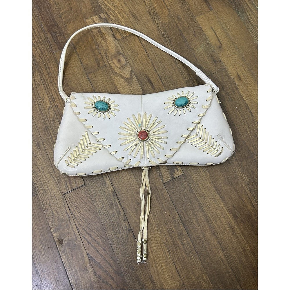 BCBGirls white Leather shoulder bag features southwestern-inspired Color Stones